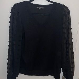 Fun black sweater with sheer sleeves!